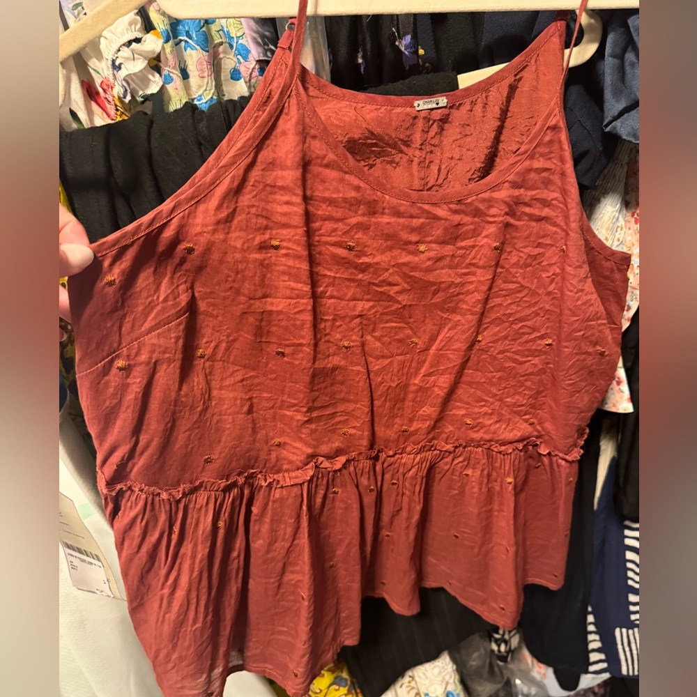 Cute tank with ruffle hem.